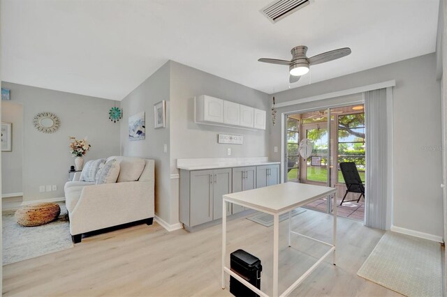 dining space featuring ceiling fan and light wood-type flooring