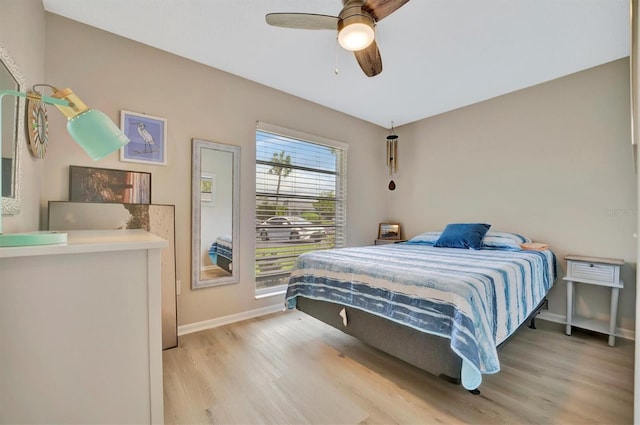 bedroom featuring light wood-type flooring and ceiling fan