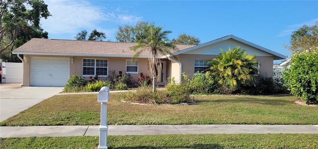 single story home with a front yard and a garage