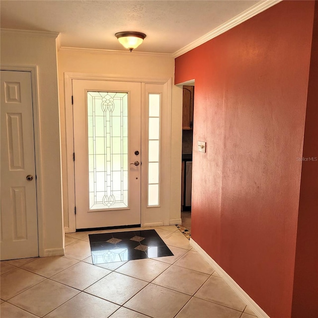 tiled foyer entrance featuring ornamental molding