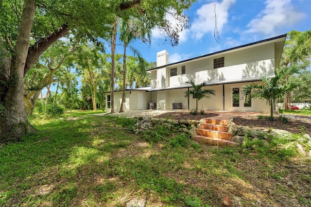 back of property featuring french doors