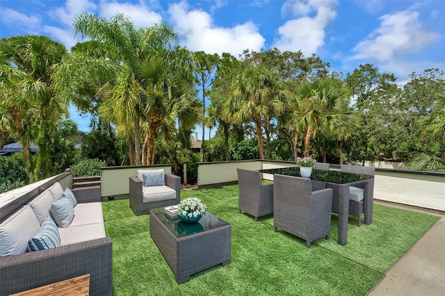 view of community with a lawn and an outdoor living space