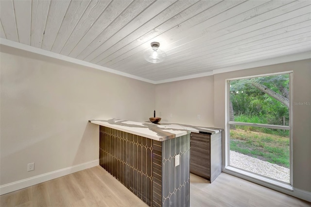 bar with light wood-type flooring, wooden ceiling, and crown molding