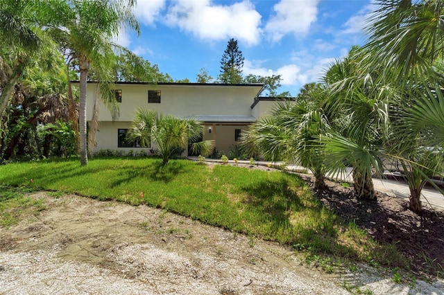 exterior space featuring a front lawn