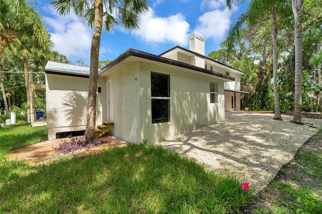 back of house with a patio area