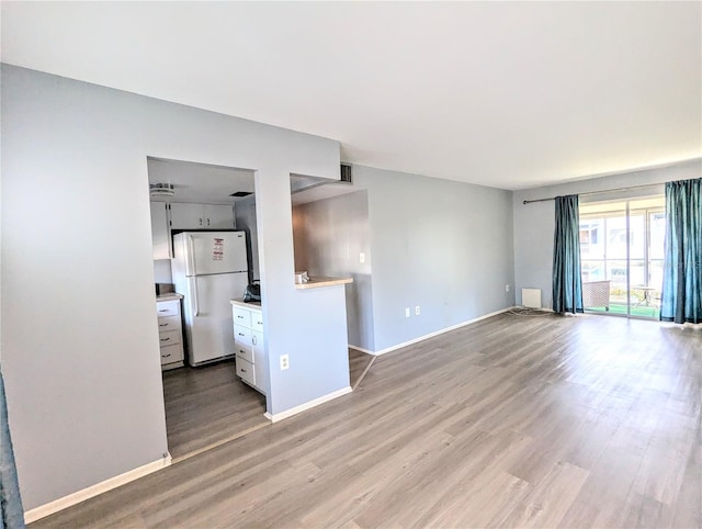 unfurnished living room featuring light hardwood / wood-style flooring