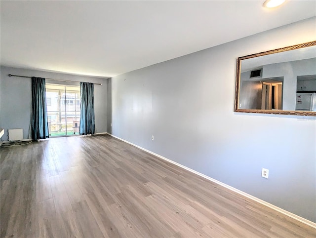 5933 17th St W Unit A24, Bradenton, FL 34207 - unfurnished room featuring wood finished floors and baseboards