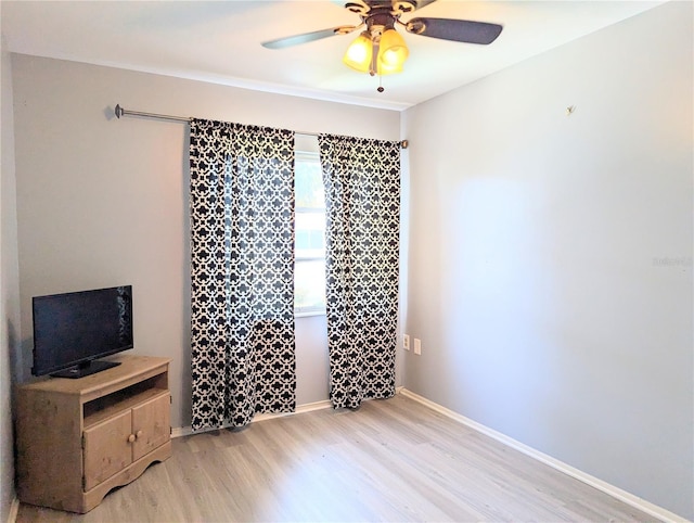 bedroom with ceiling fan and light hardwood / wood-style flooring