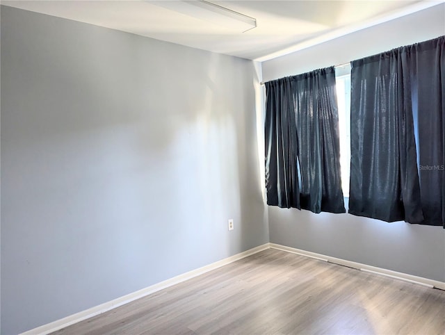 5933 17th St W Unit A24, Bradenton, FL 34207 - empty room with wood finished floors and baseboards