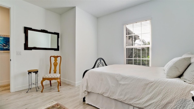 bedroom with light wood-type flooring