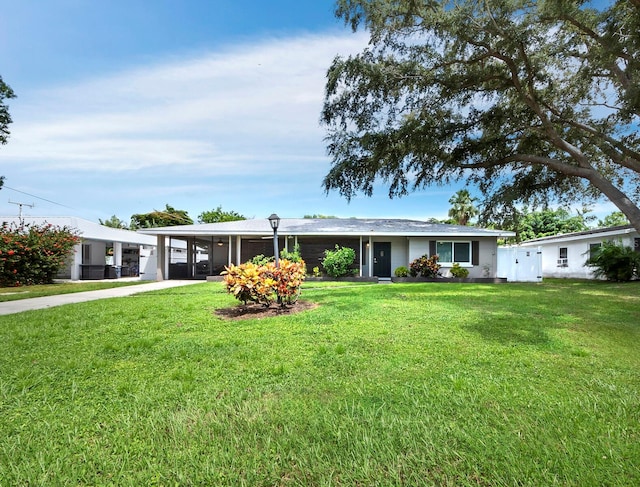 single story home featuring a front yard