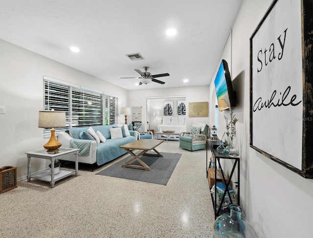 living room featuring ceiling fan