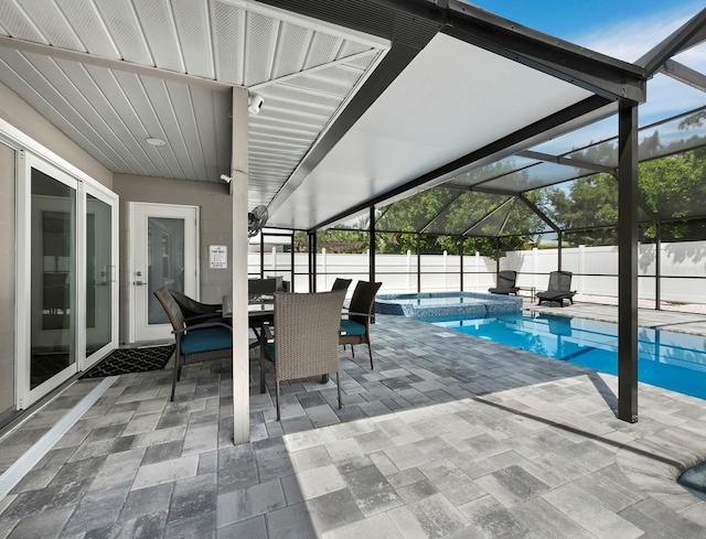 view of swimming pool featuring a patio area and a lanai