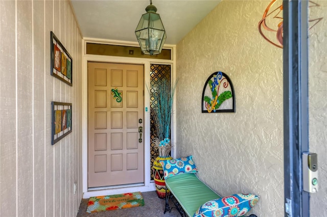 view of exterior entry with stucco siding