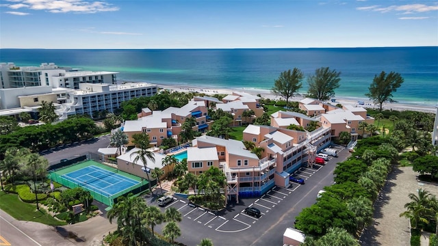 birds eye view of property with a view of the beach and a water view