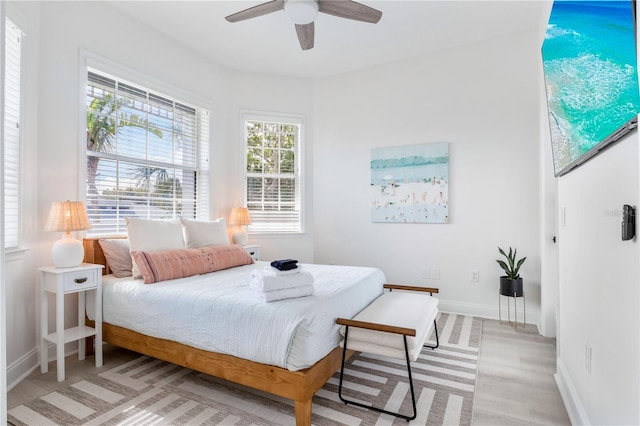 bedroom featuring ceiling fan and light hardwood / wood-style floors