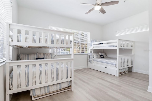 bedroom featuring ceiling fan and light hardwood / wood-style floors