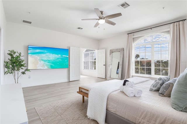 bedroom featuring light wood-type flooring and ceiling fan