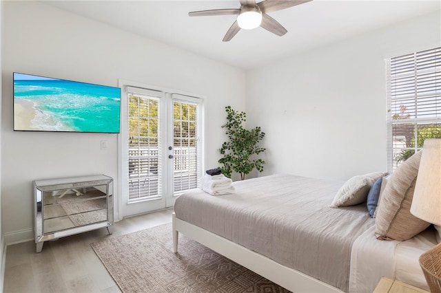 bedroom with hardwood / wood-style floors, access to exterior, and ceiling fan