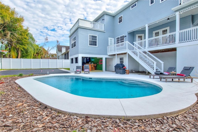 view of swimming pool featuring a patio area