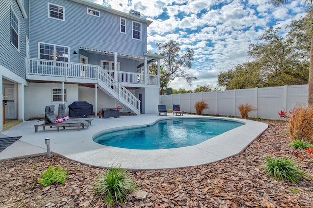 view of swimming pool with a patio area