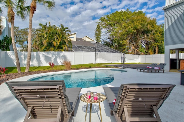 view of pool with a lanai and a patio