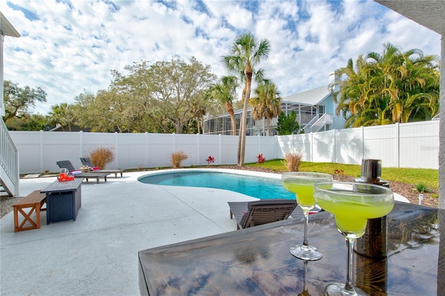 view of swimming pool featuring a patio area