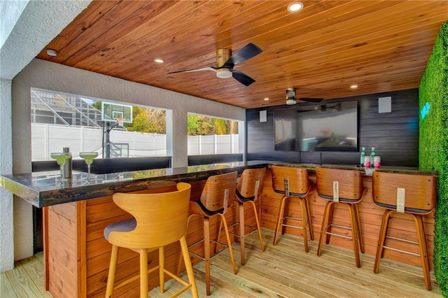 view of patio / terrace with ceiling fan and exterior bar