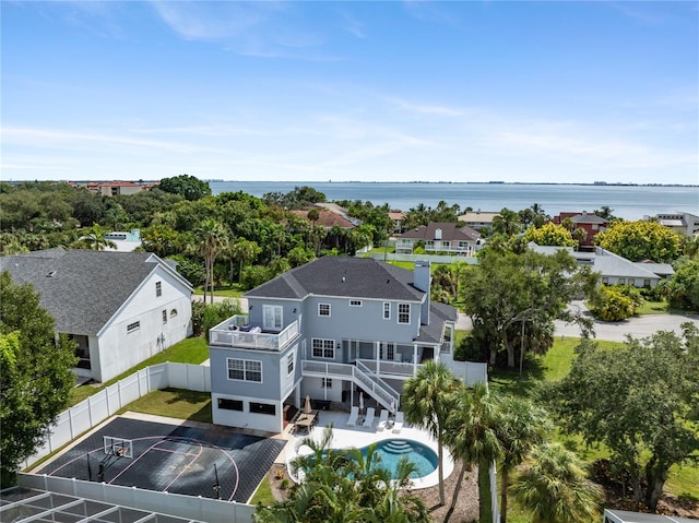 birds eye view of property with a water view