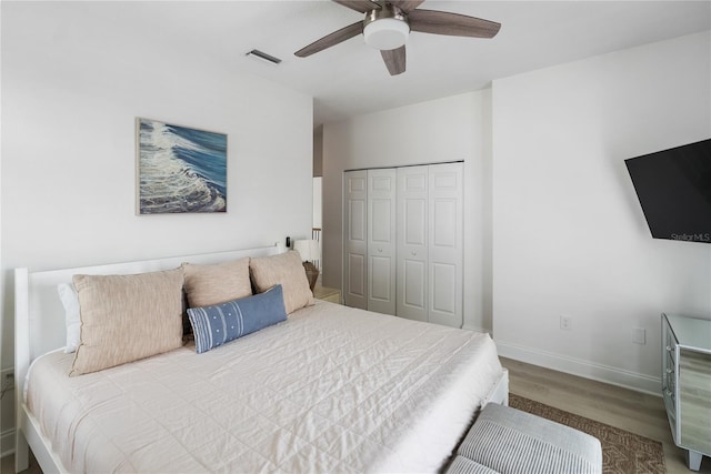 bedroom featuring a closet, ceiling fan, and wood-type flooring