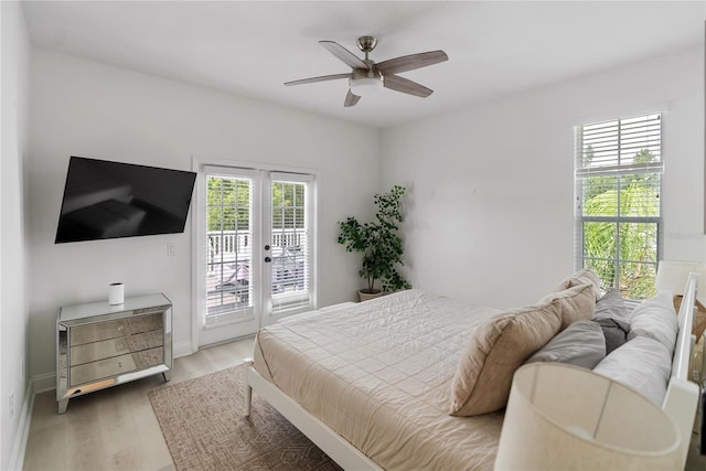 bedroom with ceiling fan, hardwood / wood-style flooring, and access to outside