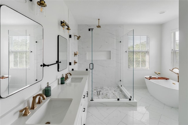 bathroom featuring vanity and separate shower and tub