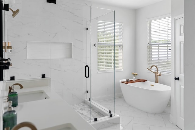 bathroom with vanity, a healthy amount of sunlight, and shower with separate bathtub