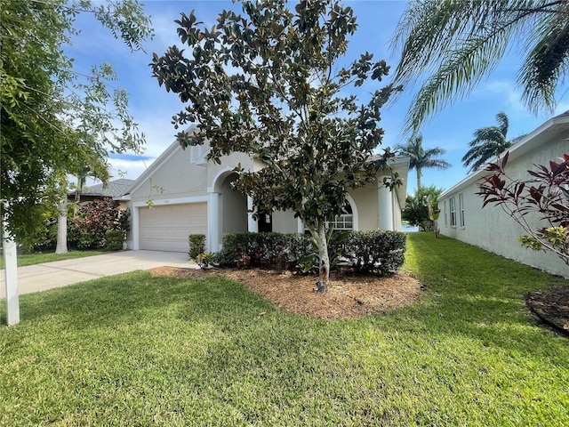 obstructed view of property with a front yard and a garage