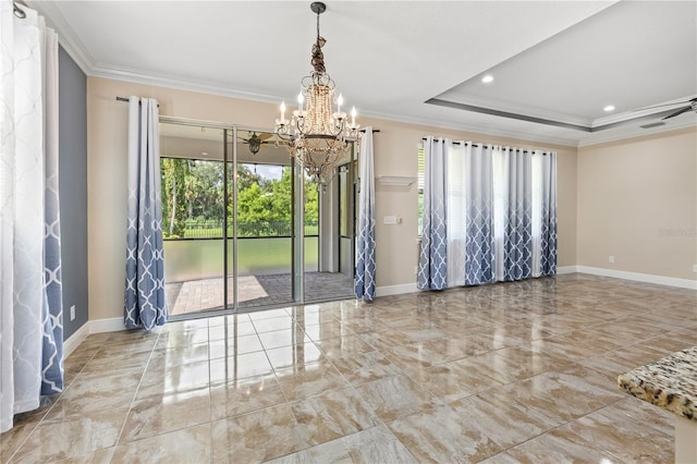 spare room featuring a notable chandelier, a raised ceiling, a healthy amount of sunlight, and crown molding