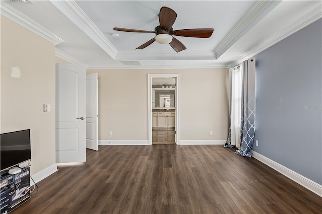 unfurnished living room featuring a tray ceiling, ceiling fan, dark hardwood / wood-style floors, and crown molding