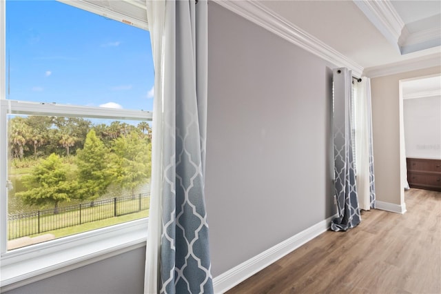 interior space featuring ornamental molding and hardwood / wood-style flooring