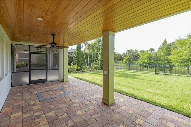 view of patio / terrace with a water view and ceiling fan