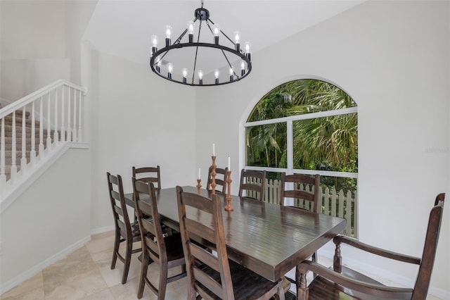 tiled dining area with a chandelier