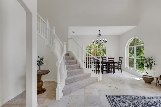 entryway featuring a notable chandelier