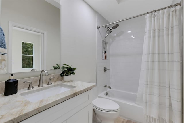 full bathroom with shower / bath combo with shower curtain, toilet, and vanity