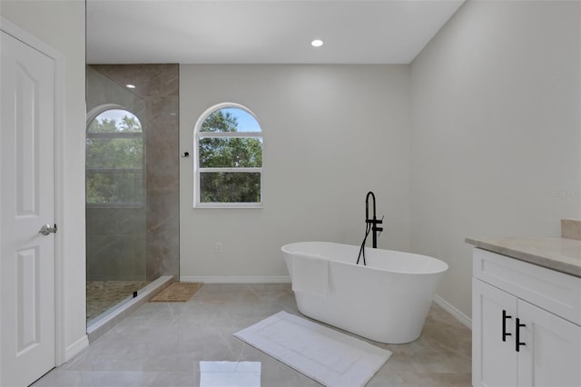 bathroom with vanity and plus walk in shower