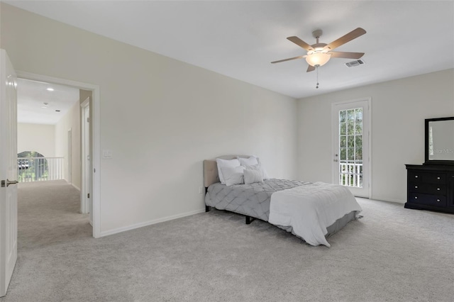 bedroom with ceiling fan, light carpet, and access to outside