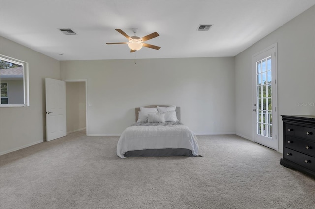 carpeted bedroom featuring ceiling fan and access to outside