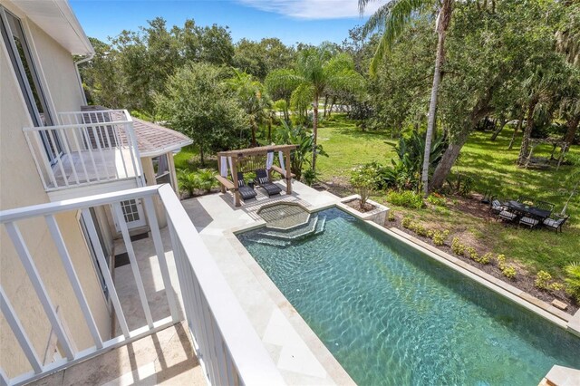 view of pool featuring a lawn and a patio