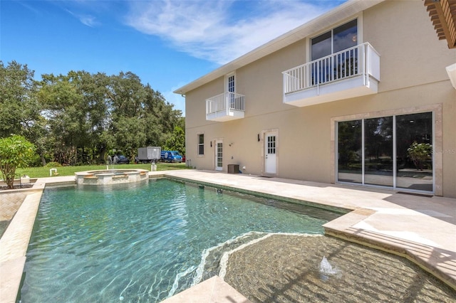 view of pool featuring an in ground hot tub and a patio area