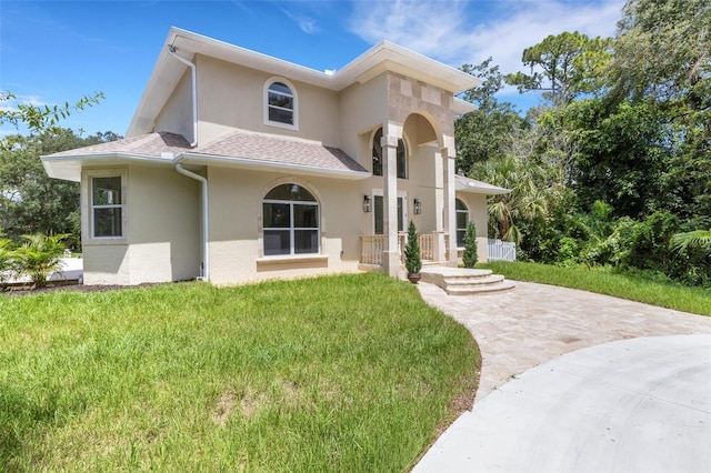 exterior space featuring a front lawn and a porch