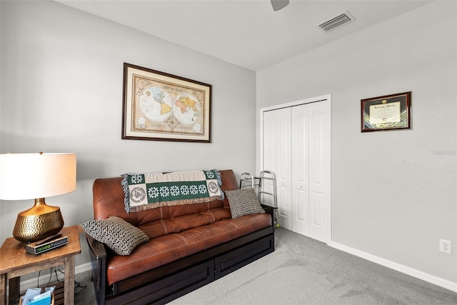 living room featuring light carpet