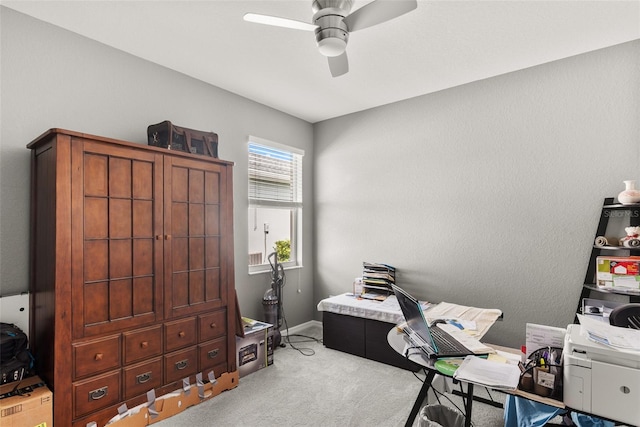 office area featuring light colored carpet and ceiling fan