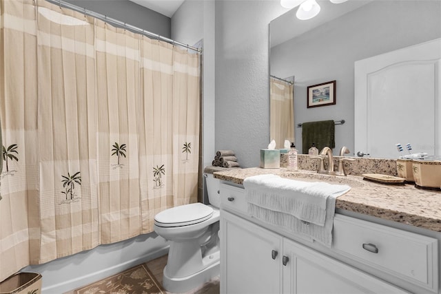 full bathroom with vanity, toilet, shower / tub combo with curtain, and tile patterned floors